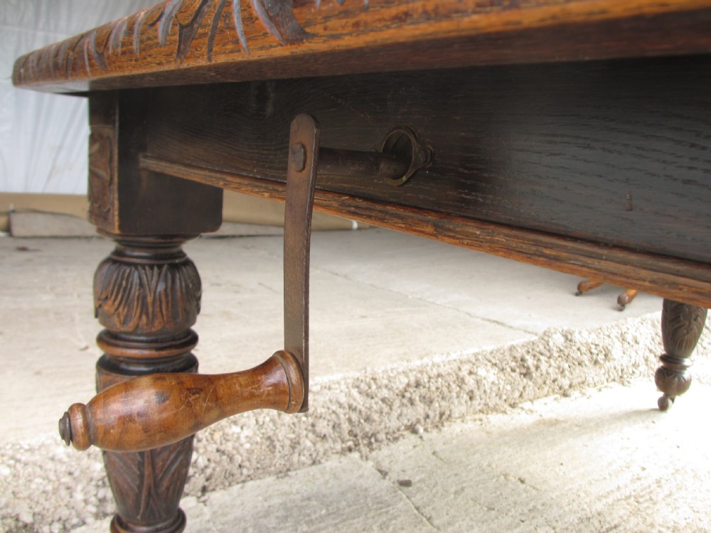 Victorian oak carved extending dining table View VIII