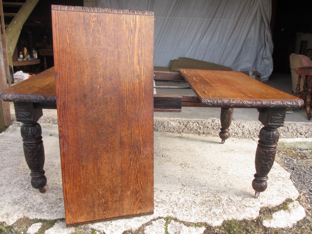 Victorian oak carved extending dining table View IX