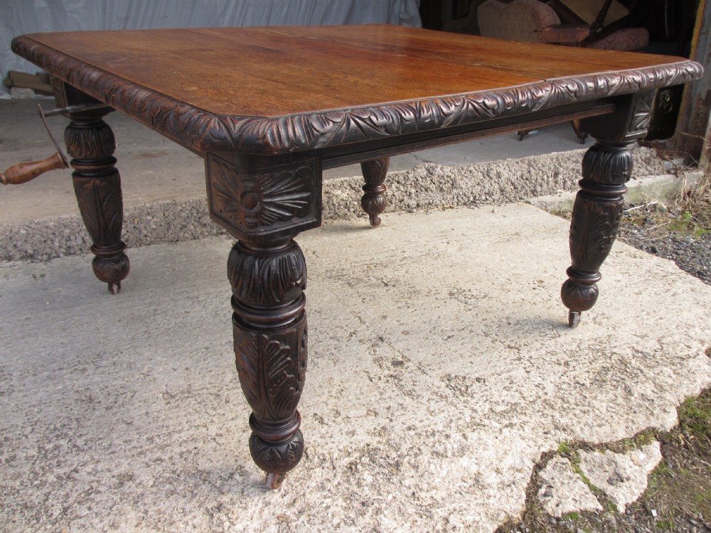 Victorian oak carved extending dining table View XI