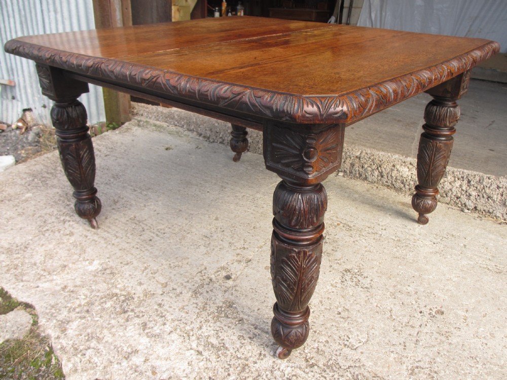 Victorian oak carved extending dining table View XII