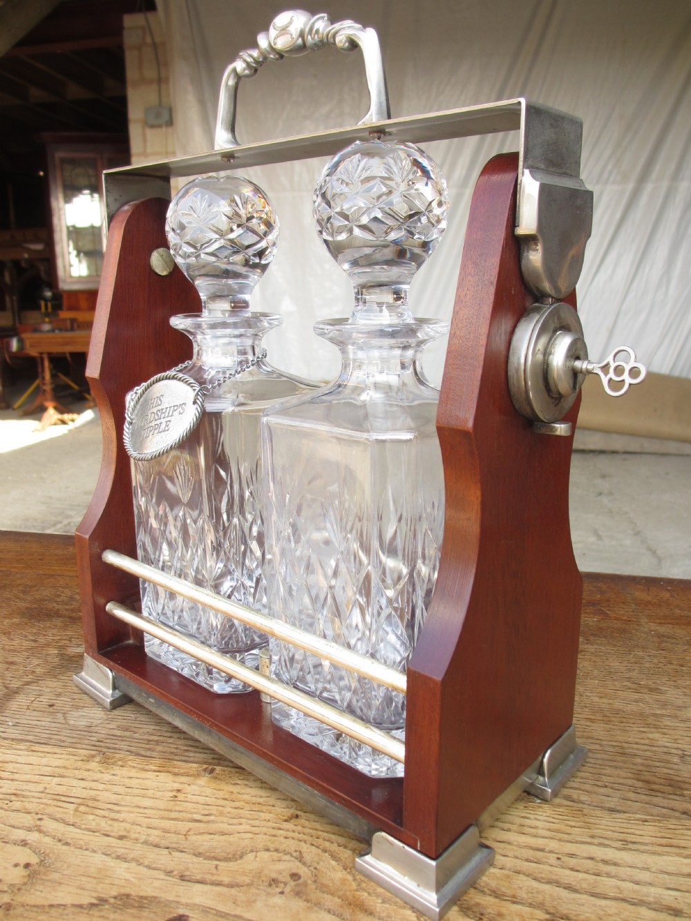Edwardian 2 bottled Tantalus in a mahogany frame View II