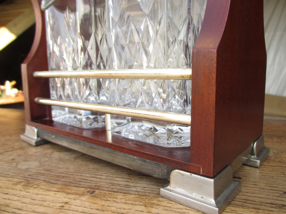 Edwardian 2 bottled Tantalus in a mahogany frame View V