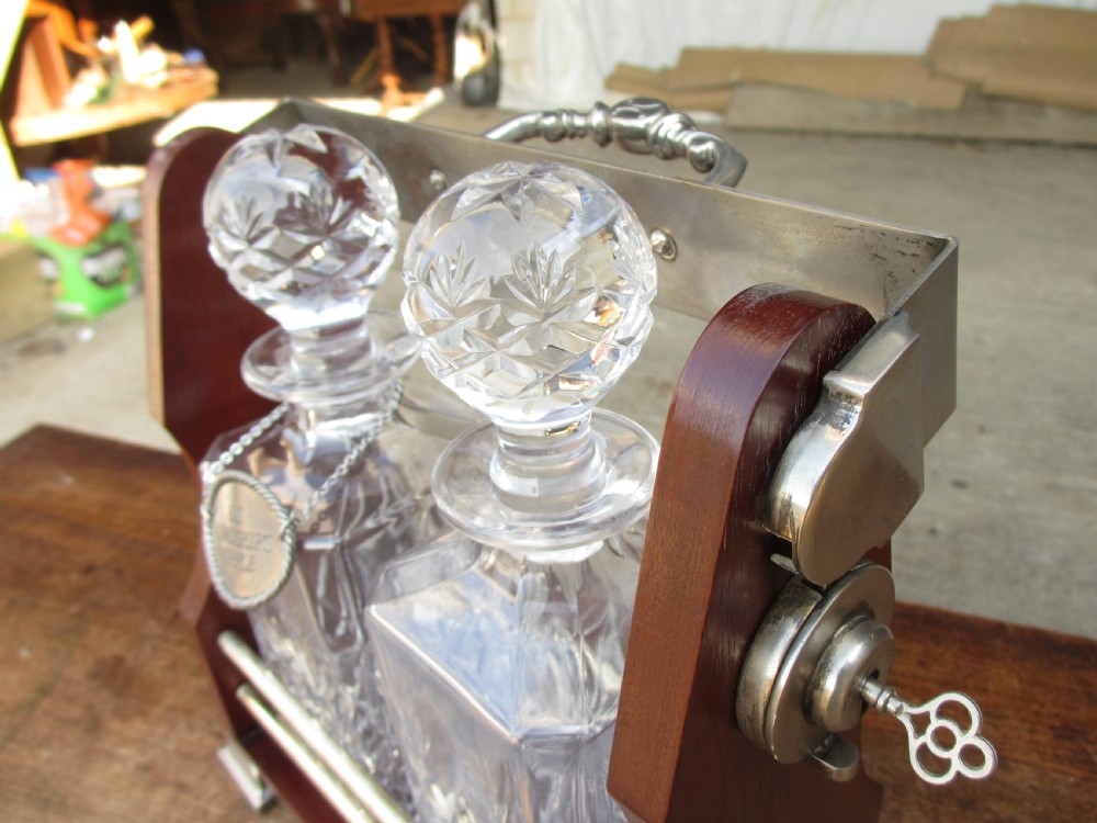 Edwardian 2 bottled Tantalus in a mahogany frame View VIII