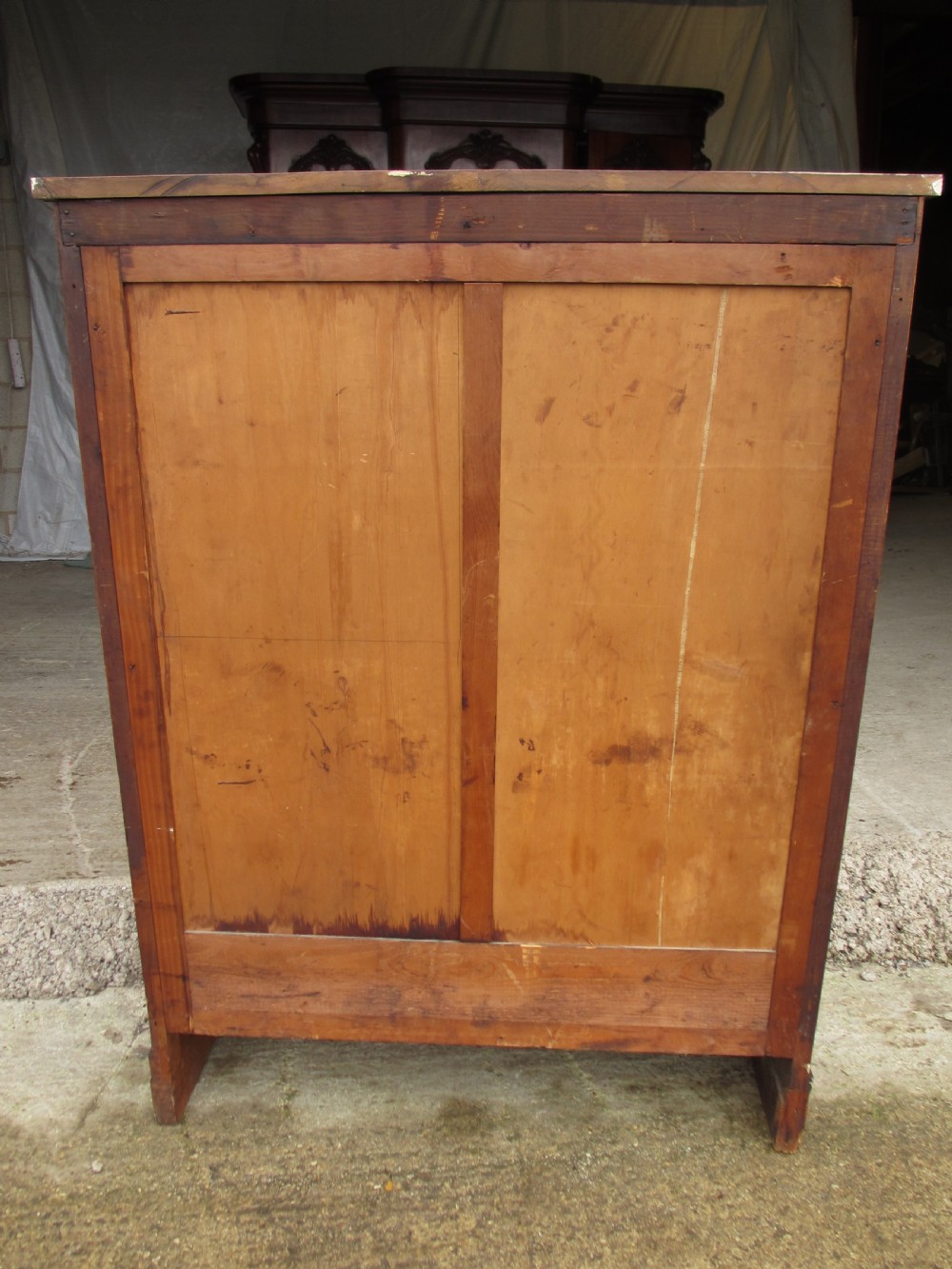 An antique Regency mahogany and walnut bookcase cabinet featuring twin doors and side panels with diamond lattice metal grilles. View VIII