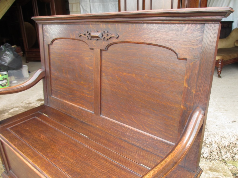 victorian oak panelled box settle with scroll and bobbin turned arms View IV