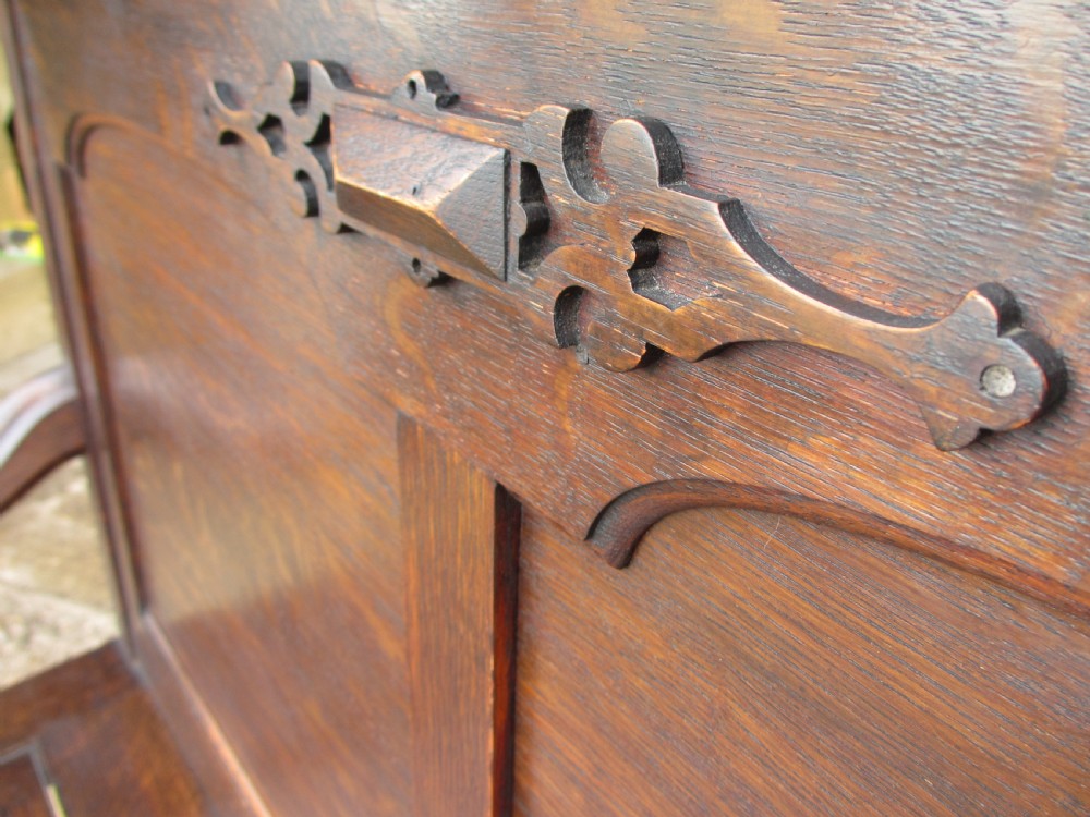 victorian oak panelled box settle with scroll and bobbin turned arms View V