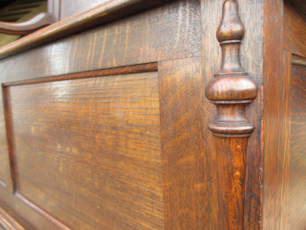 victorian oak panelled box settle with scroll and bobbin turned arms View IX