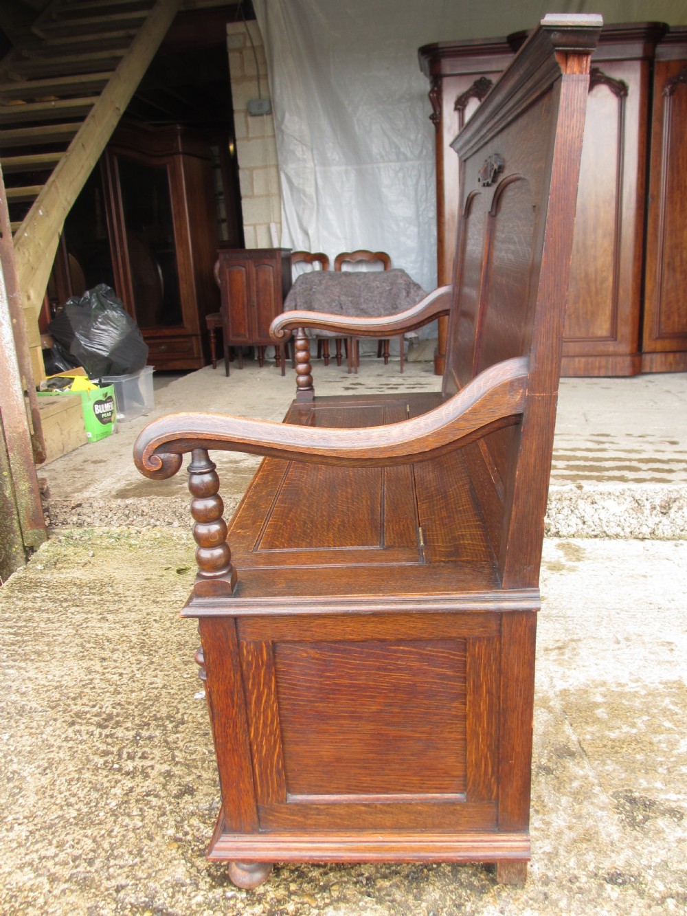 victorian oak panelled box settle with scroll and bobbin turned arms View XI