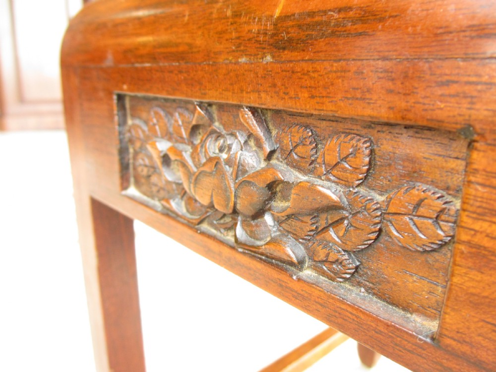 A set of four graduating rosewood side tables nested together, featuring relief-carved lotus friezes and straight legs. View VII