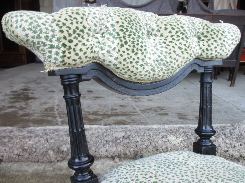 19th century ebonised and upholstered nursing chair with brass castors View IV