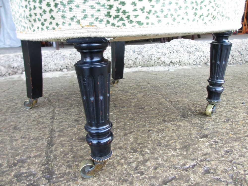 19th century ebonised and upholstered nursing chair with brass castors View VI