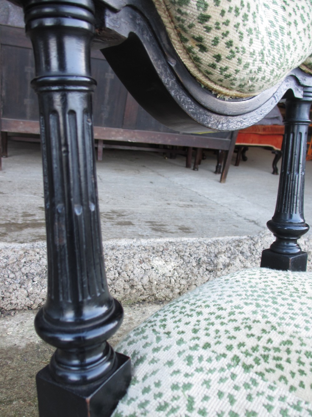 19th century ebonised and upholstered nursing chair with brass castors View X