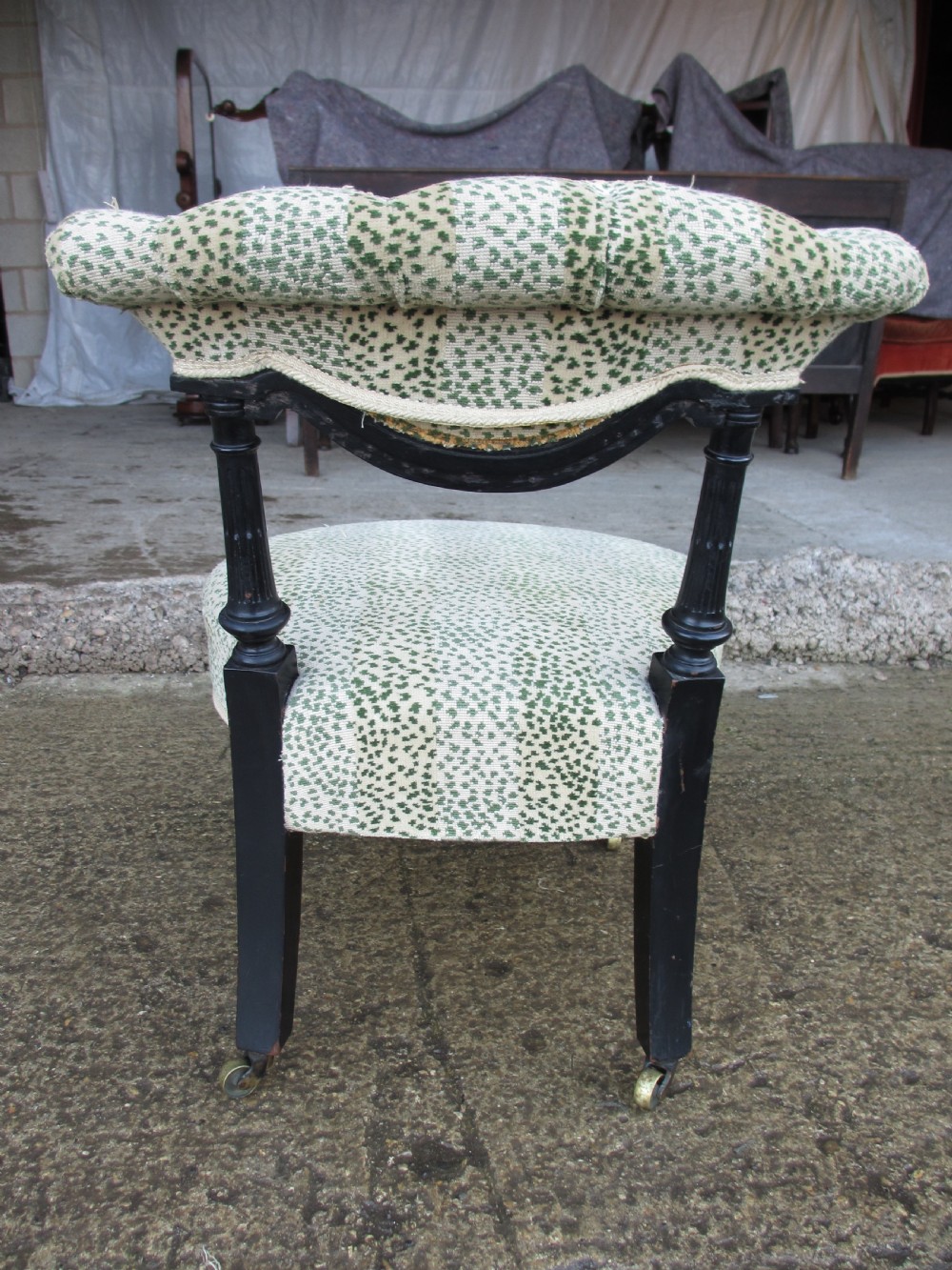 19th century ebonised and upholstered nursing chair with brass castors View XIII