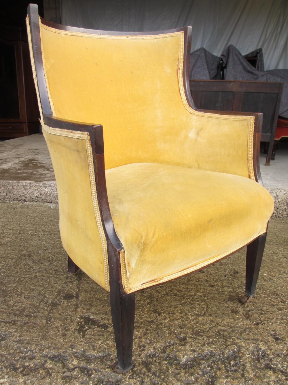 A 19th-century mahogany framed tub armchair featuring yellow velvet upholstery and square tapered legs. View III