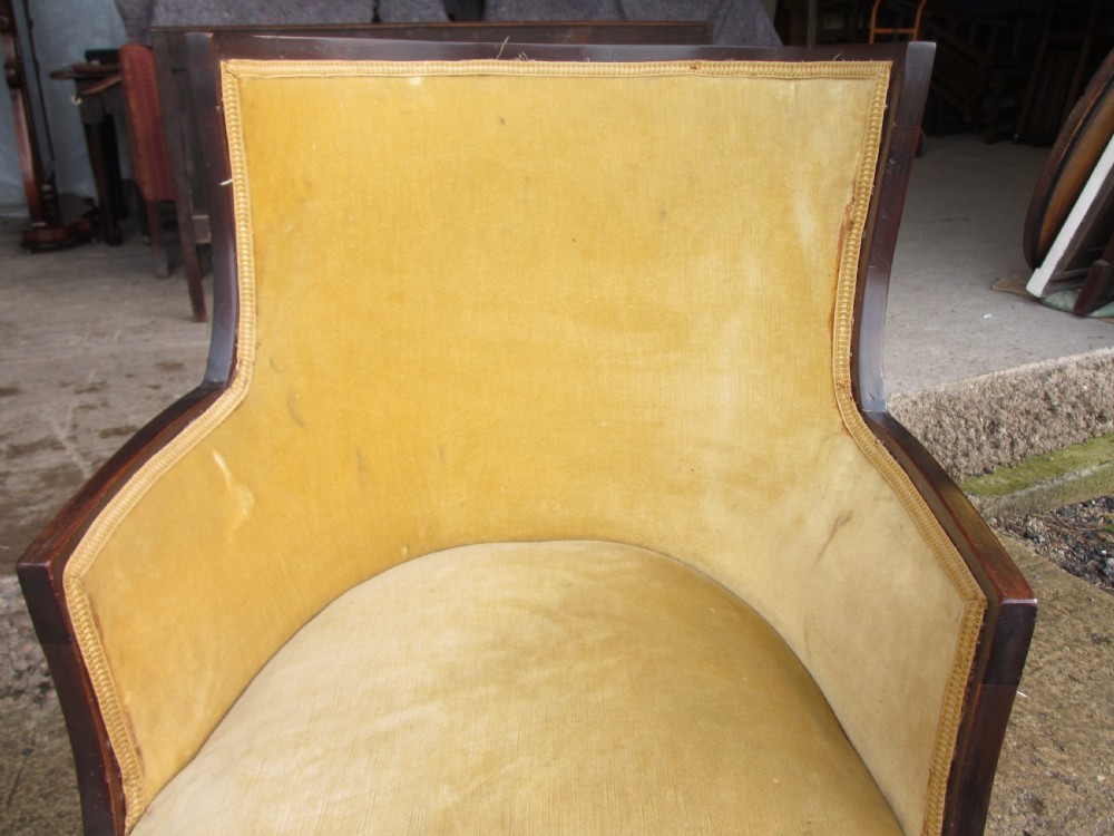 A 19th-century mahogany framed tub armchair featuring yellow velvet upholstery and square tapered legs. View IV
