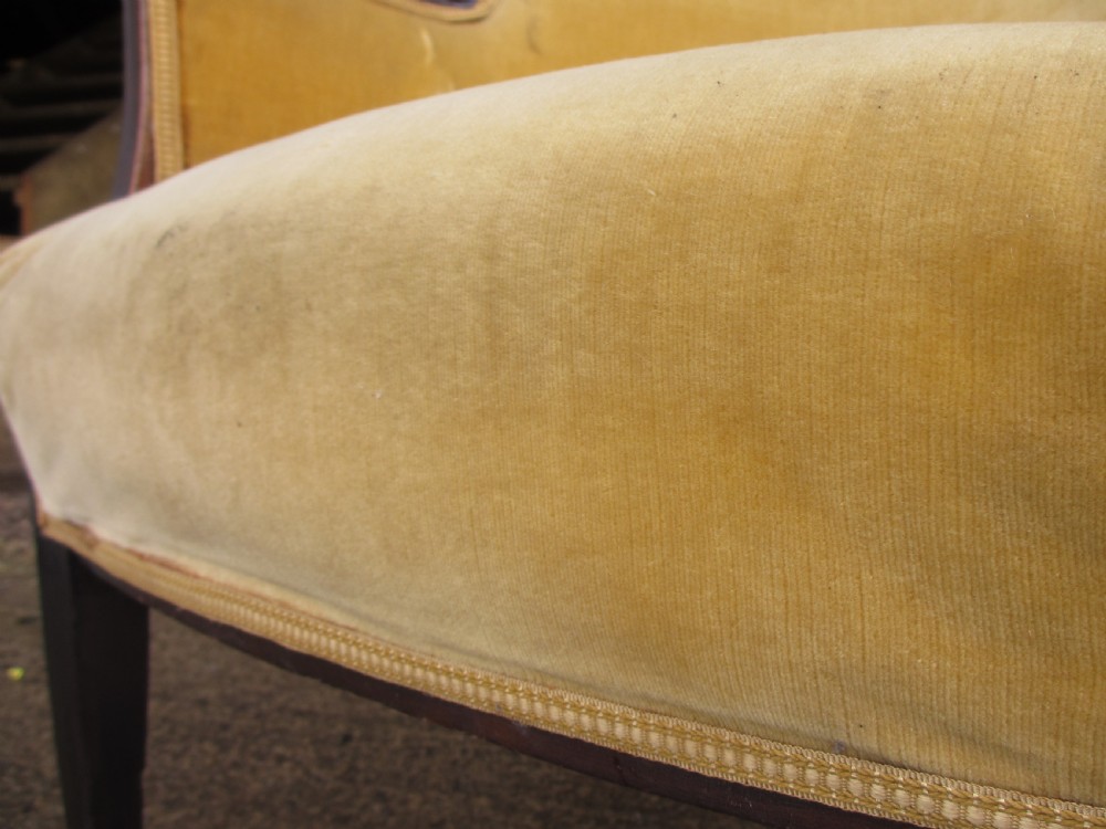 A 19th-century mahogany framed tub armchair featuring yellow velvet upholstery and square tapered legs. View VIII