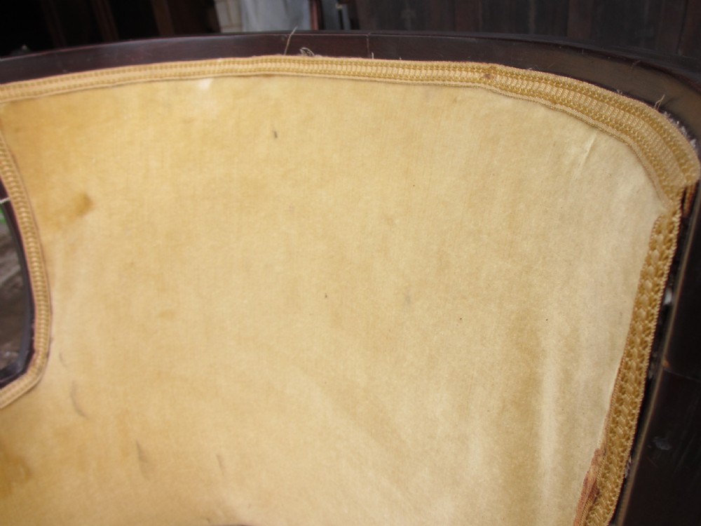 A 19th-century mahogany framed tub armchair featuring yellow velvet upholstery and square tapered legs. View X