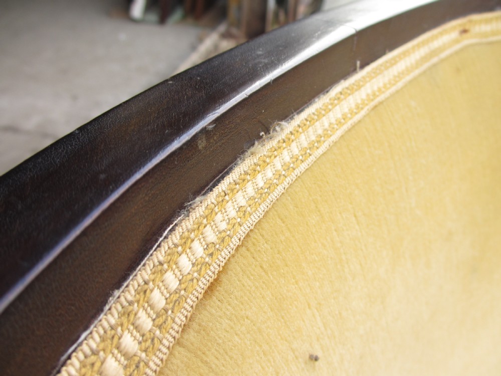 A 19th-century mahogany framed tub armchair featuring yellow velvet upholstery and square tapered legs. View XI