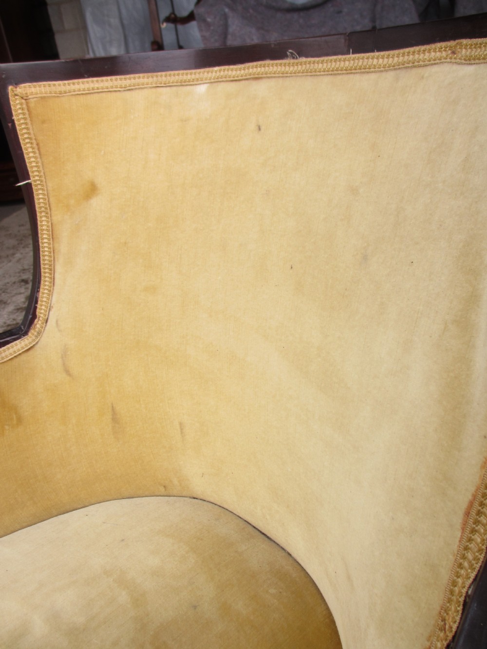 A 19th-century mahogany framed tub armchair featuring yellow velvet upholstery and square tapered legs. View XII