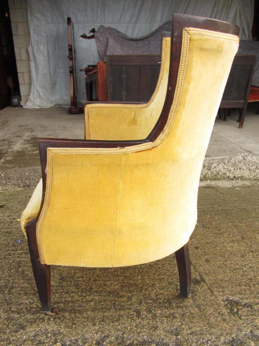 A 19th-century mahogany framed tub armchair featuring yellow velvet upholstery and square tapered legs. View XIII