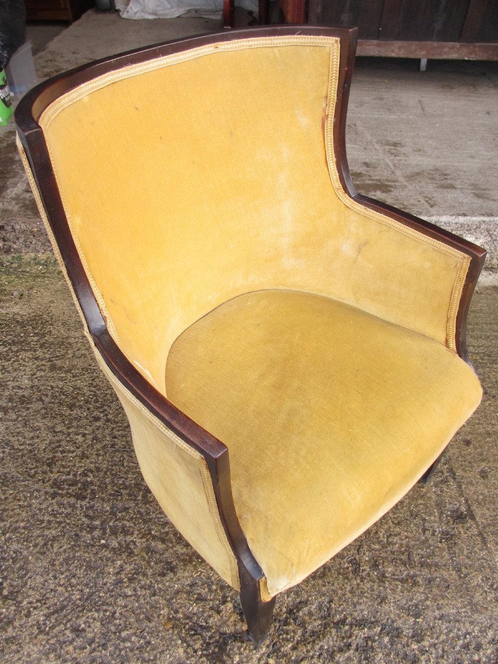 A 19th-century mahogany framed tub armchair featuring yellow velvet upholstery and square tapered legs. View XV