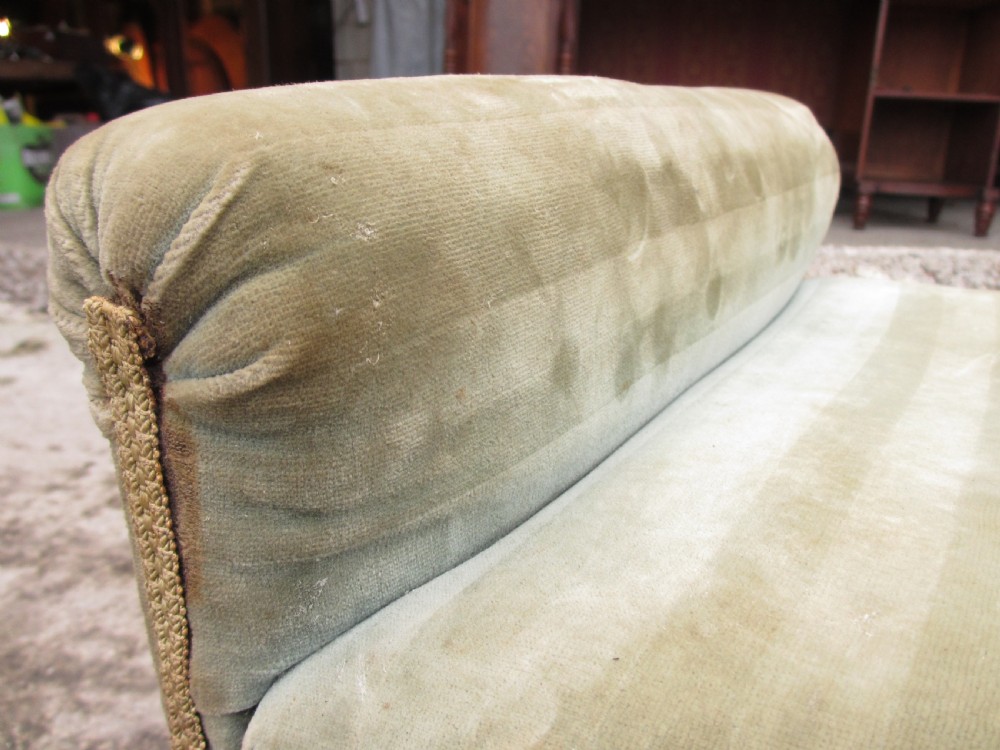 A nineteenth-century beechwood gout stool with an adjustable angled top upholstered in light green striped velvet fabric set upon a dark timber ratchet frame. View XII