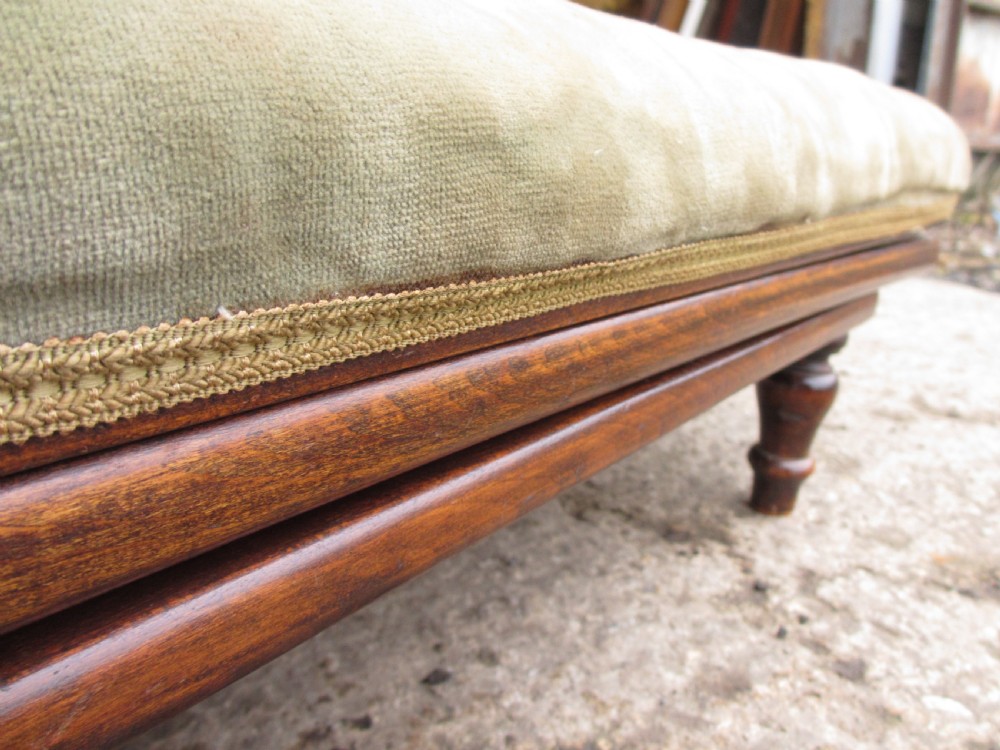 A nineteenth-century beechwood gout stool with an adjustable angled top upholstered in light green striped velvet fabric set upon a dark timber ratchet frame. View XIII