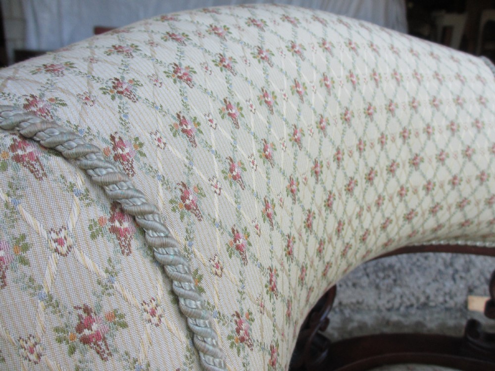 A five-piece antique mahogany parlour suite including a settee, two tub armchairs, and two side chairs with cream patterned upholstery and carved details. View XV