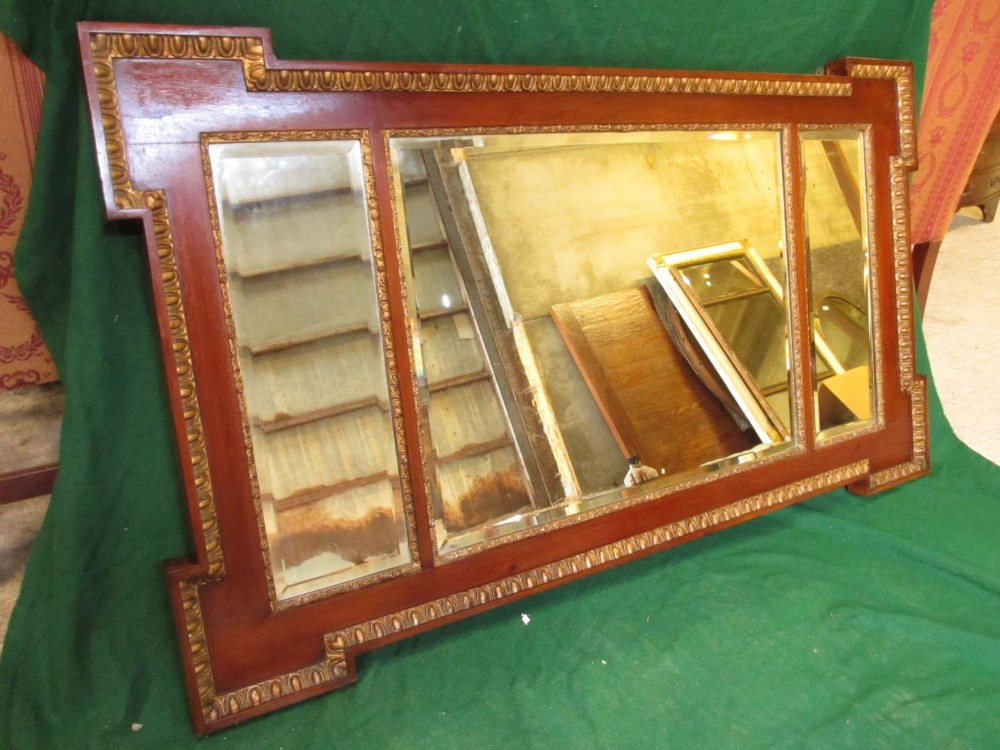 A horizontal 19th-century mahogany triple plate wall mirror featuring gilt egg-and-dart moulding along the frame with breakfront corner detailing. View II