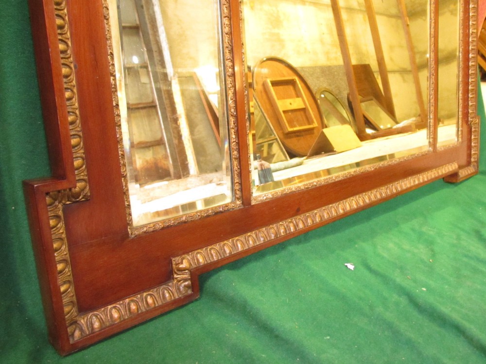 A horizontal 19th-century mahogany triple plate wall mirror featuring gilt egg-and-dart moulding along the frame with breakfront corner detailing. View VII