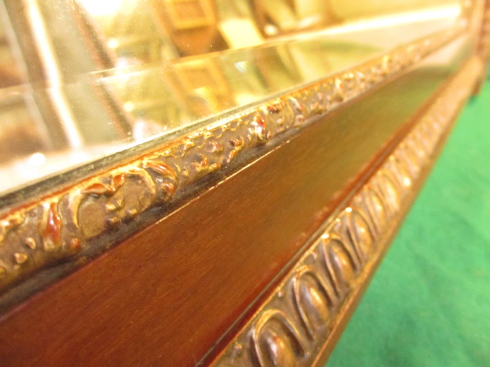 A horizontal 19th-century mahogany triple plate wall mirror featuring gilt egg-and-dart moulding along the frame with breakfront corner detailing. View VIII