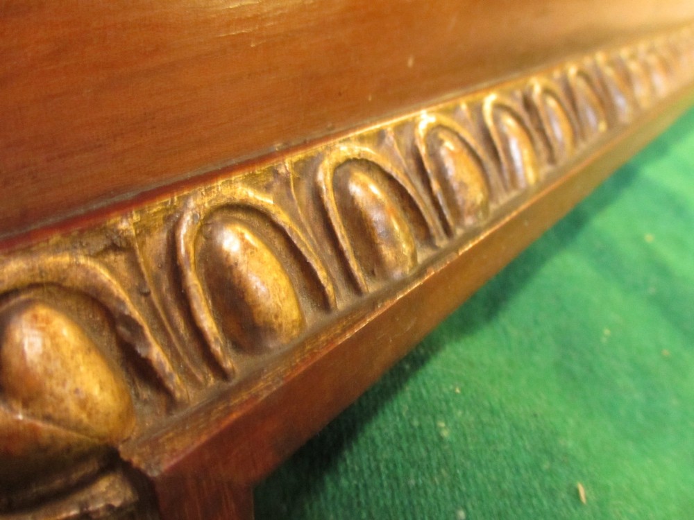 A horizontal 19th-century mahogany triple plate wall mirror featuring gilt egg-and-dart moulding along the frame with breakfront corner detailing. View IX