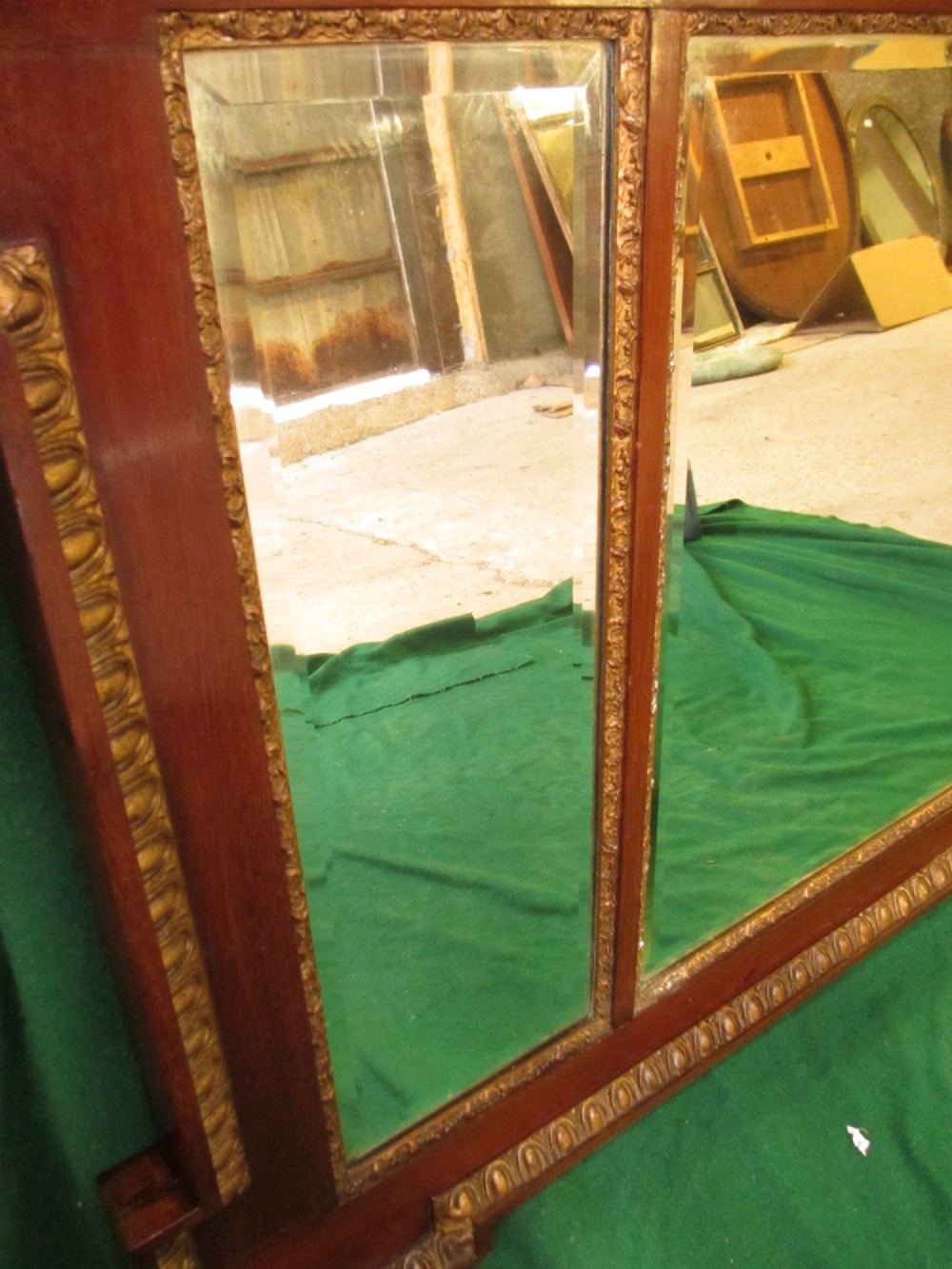 A horizontal 19th-century mahogany triple plate wall mirror featuring gilt egg-and-dart moulding along the frame with breakfront corner detailing. View X