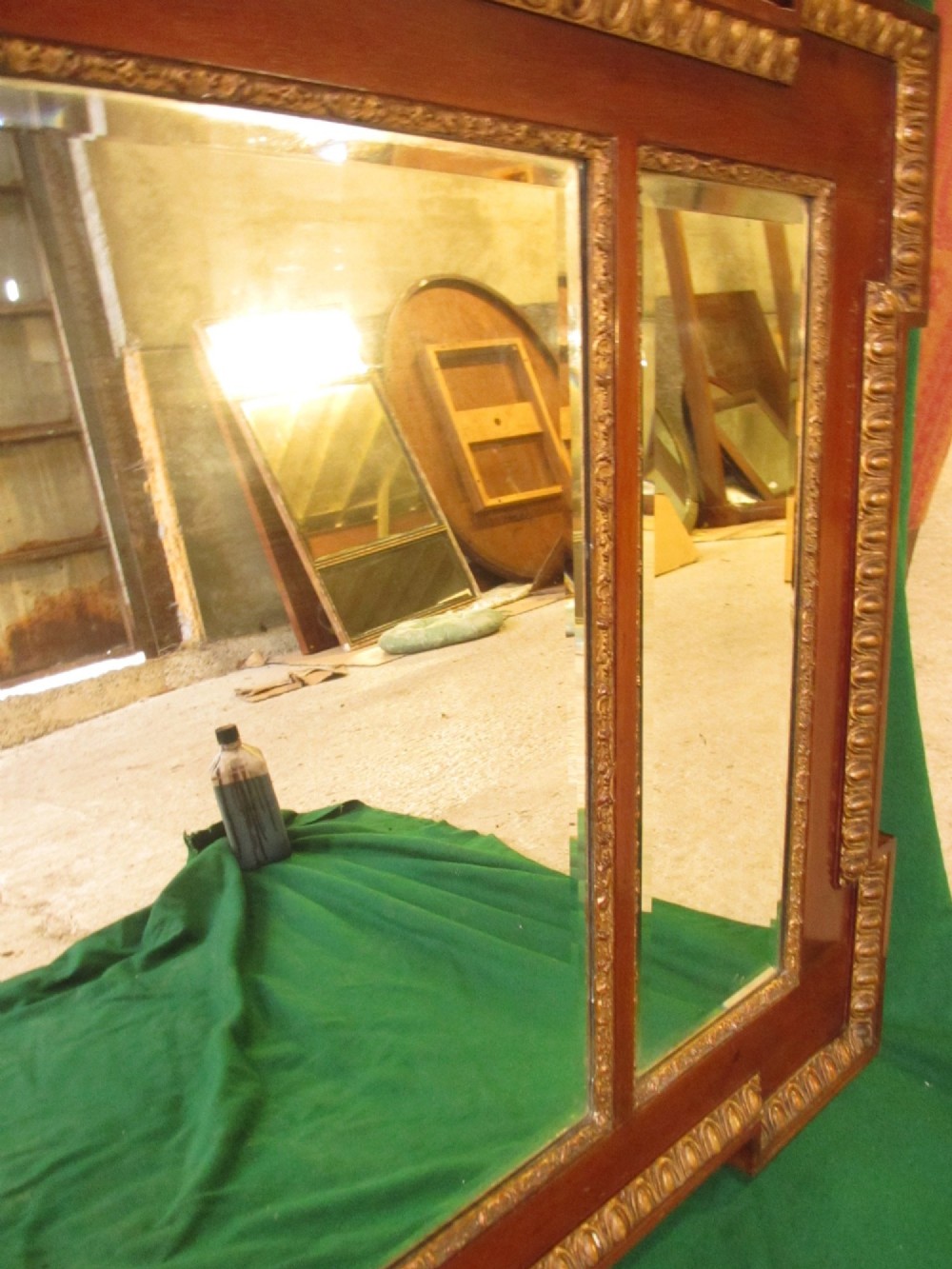 A horizontal 19th-century mahogany triple plate wall mirror featuring gilt egg-and-dart moulding along the frame with breakfront corner detailing. View XI