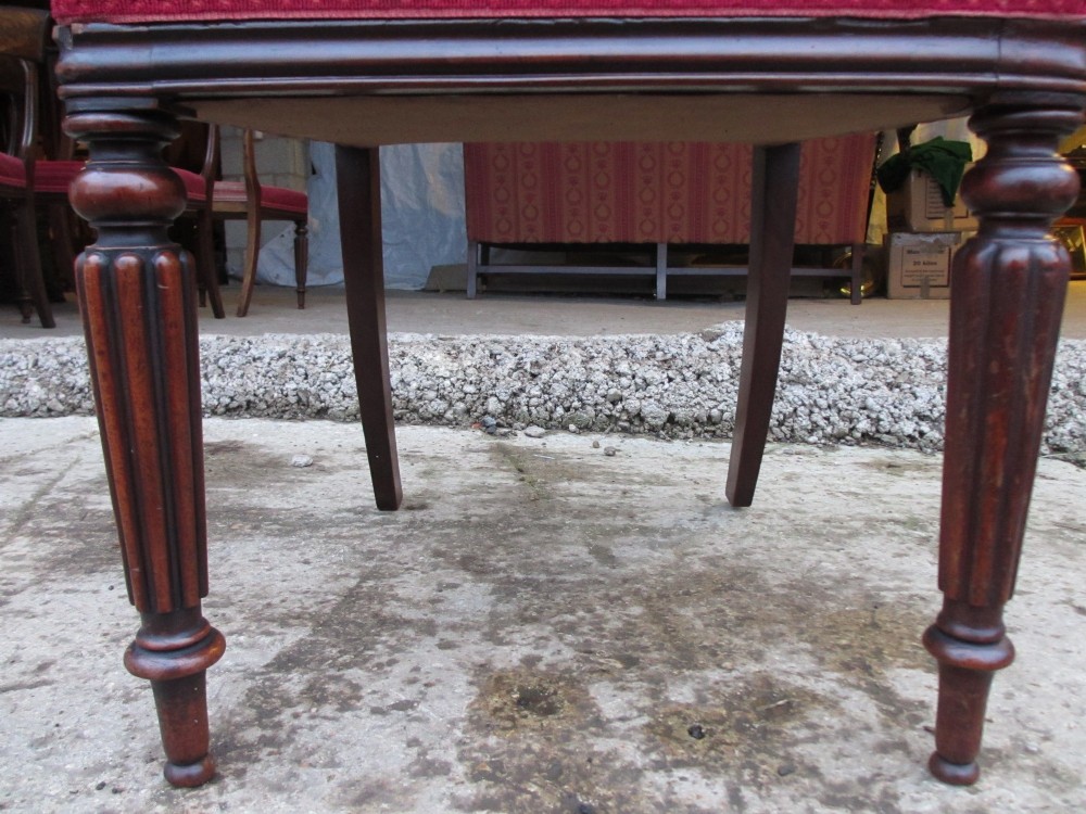A set of six William IV mahogany dining chairs featuring curved top rails with flame mahogany veneer, reeded turned front legs, and red striped upholstered seats. View XII