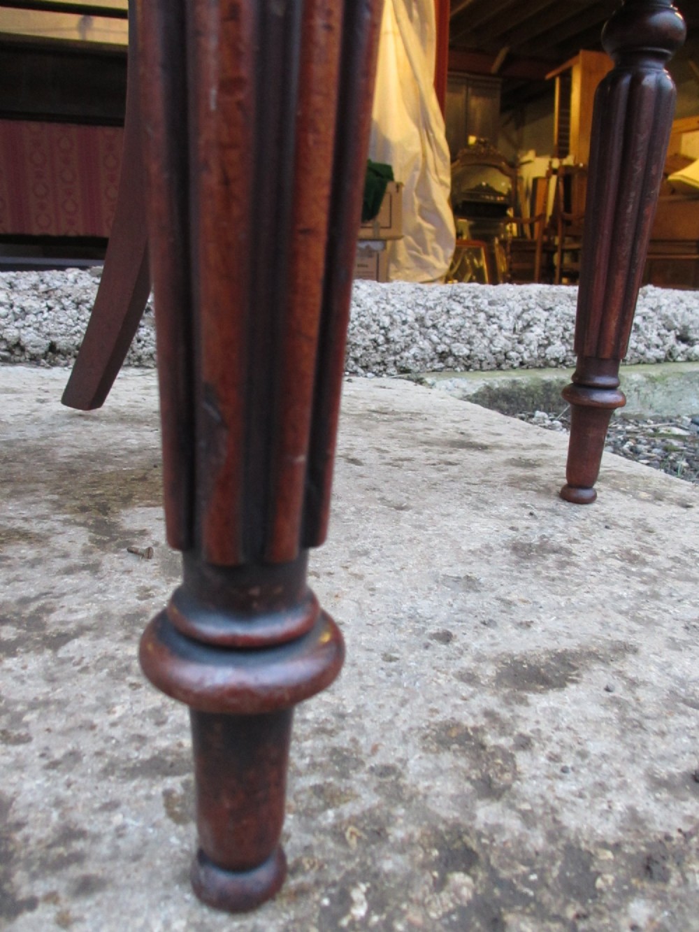 A set of six William IV mahogany dining chairs featuring curved top rails with flame mahogany veneer, reeded turned front legs, and red striped upholstered seats. View XIII