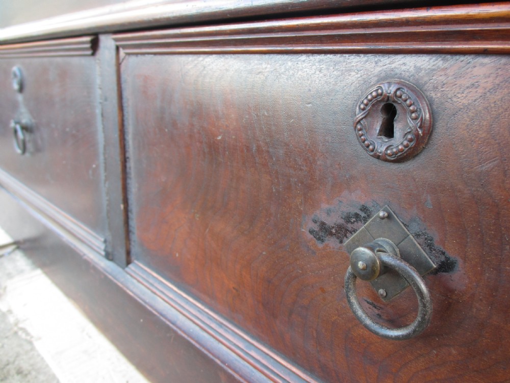 A tall 19th-century mahogany glazed bookcase featuring two long arched glass doors above a base fitted with two drawers. View VII
