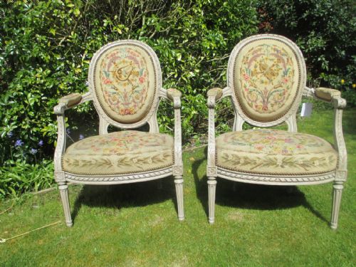 A Pair of Painted Needlepoint Armchairs