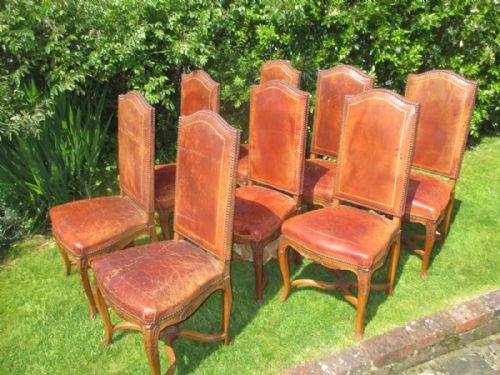 Eight Leather High Backed Dining Chairs