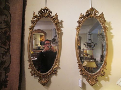 A Pair of Oval Gilt Mirrors