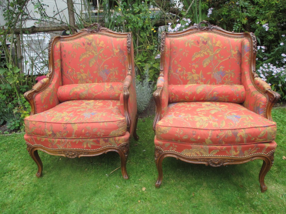 Pair of carved Walnut Bergere Armchairs
