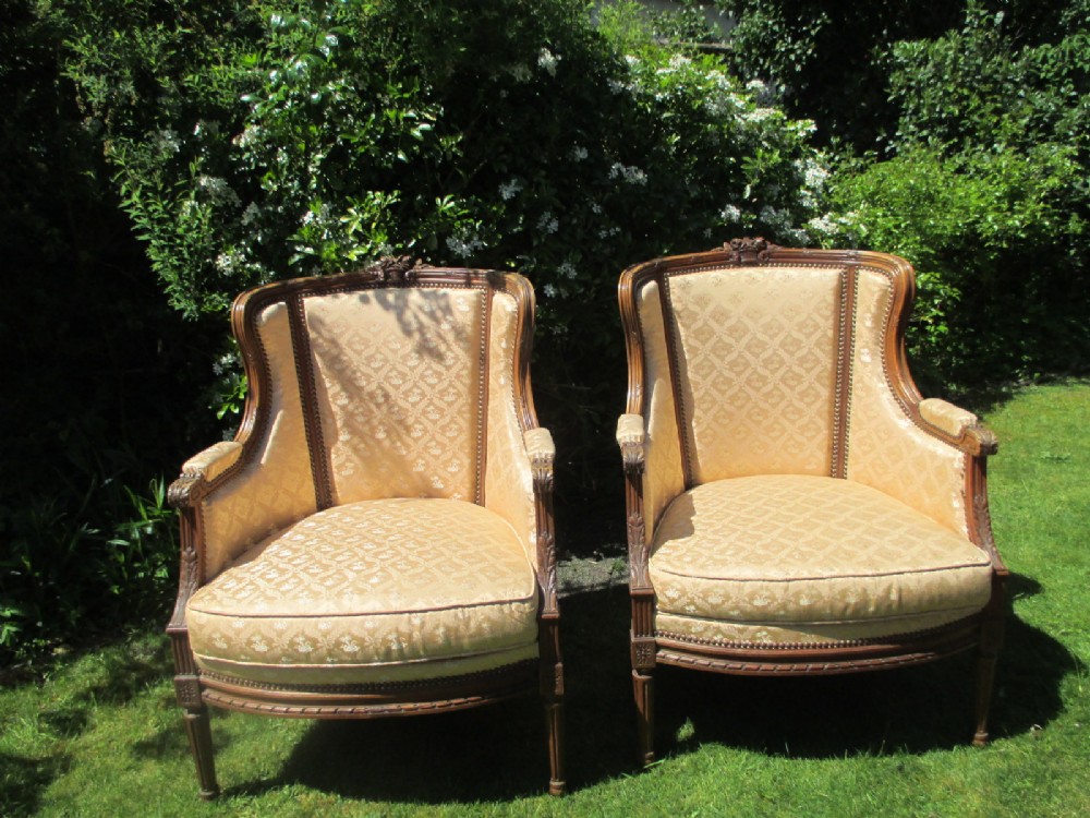 Pair of walnut Bergere Armchairs 
