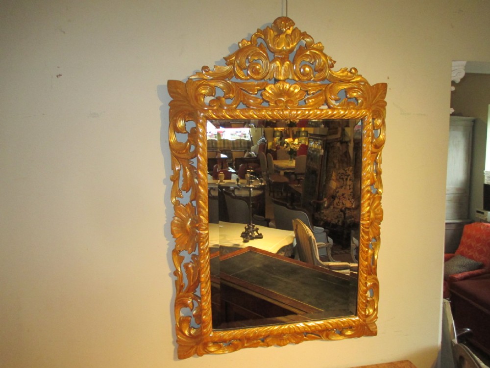 Carved gilt cushion mirror
