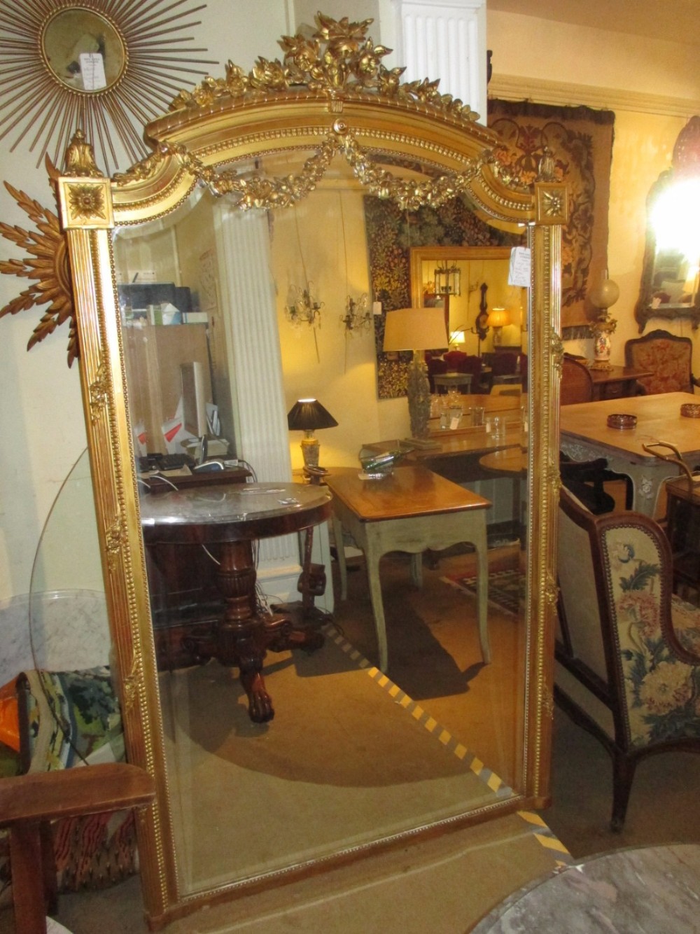Louis XVI style gilt mirror with swags