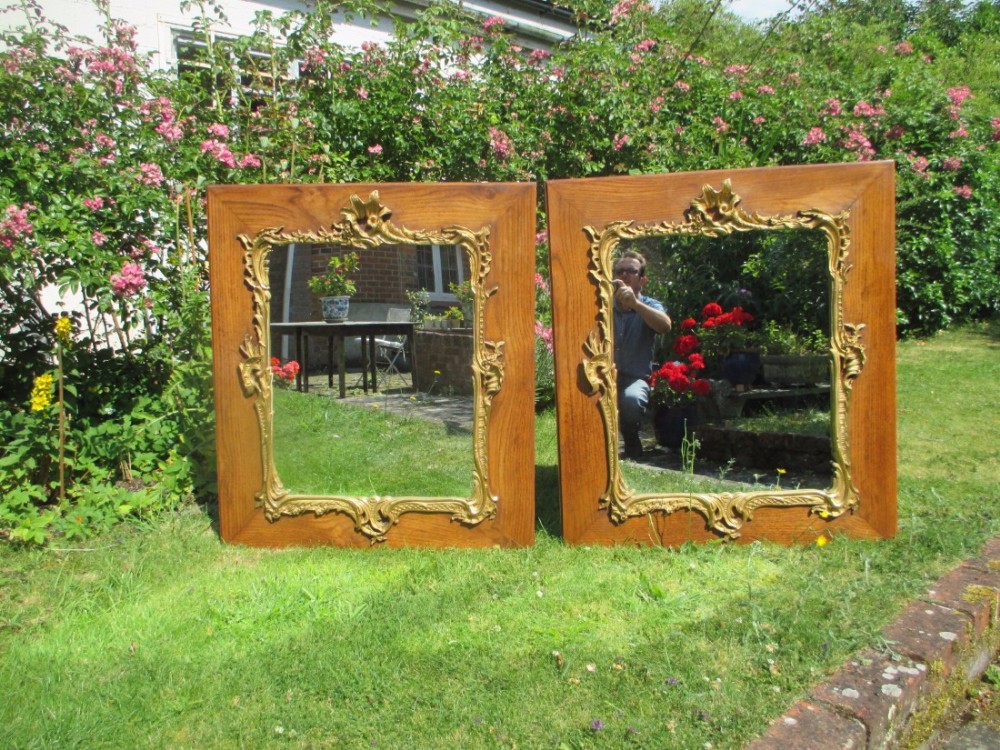 Pair of oak and gilt mirrors