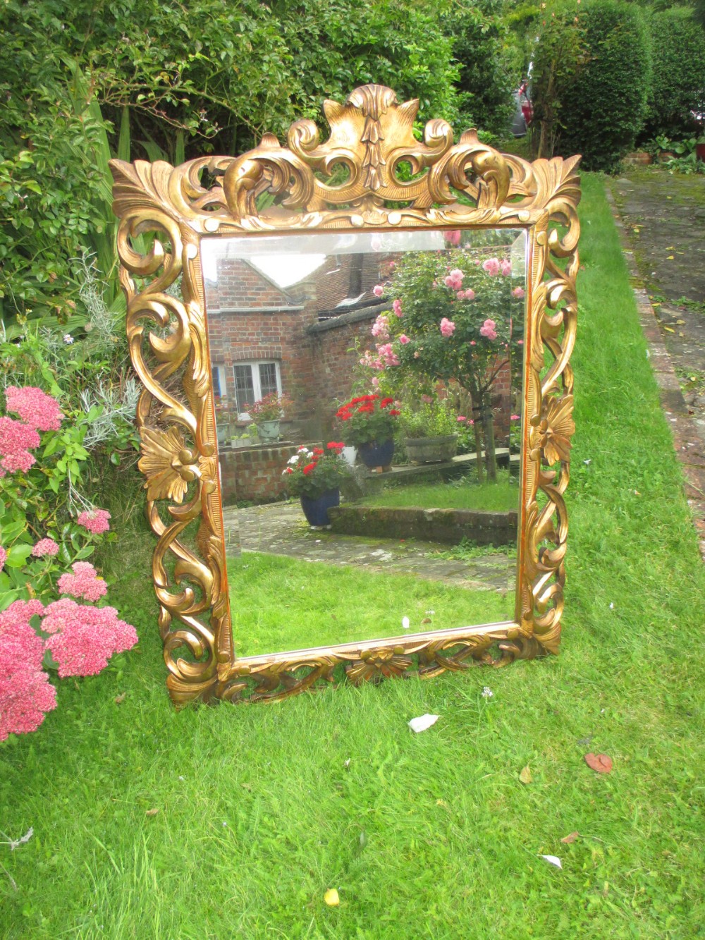 Carved gilt wood cushion mirror