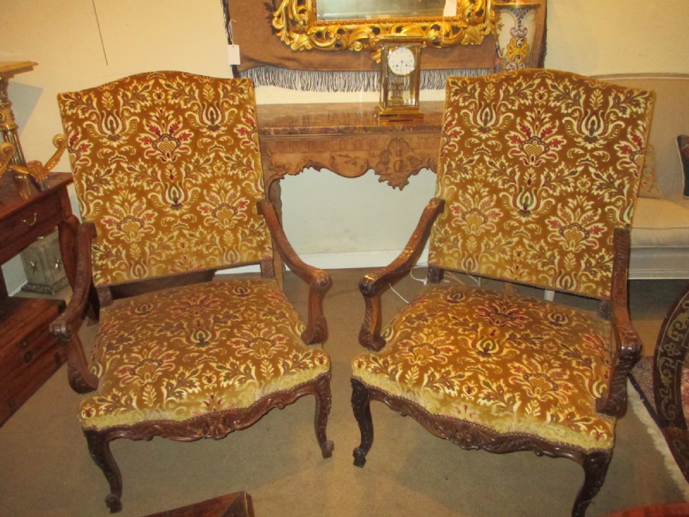 Pair of large carved walnut armchairs