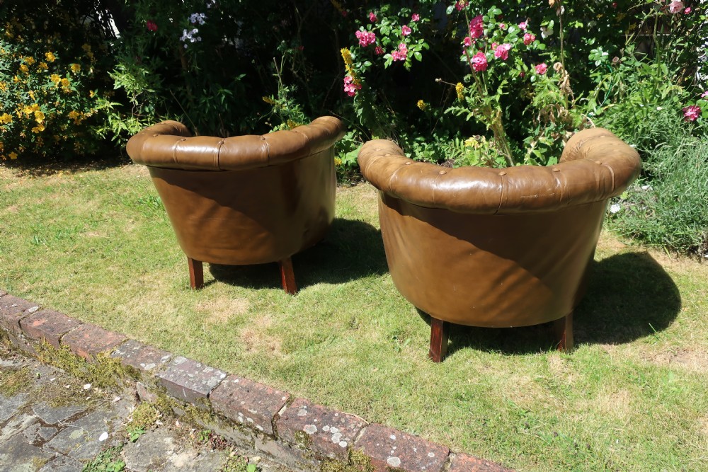 Pair of button-back leather tub chairs View VI