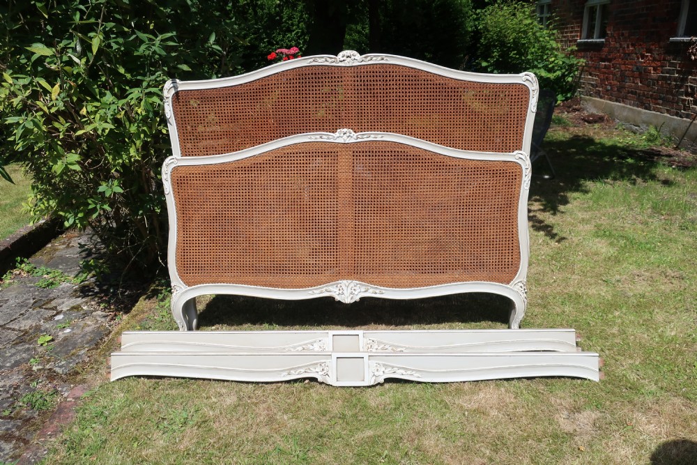 Kingsize painted cane bed