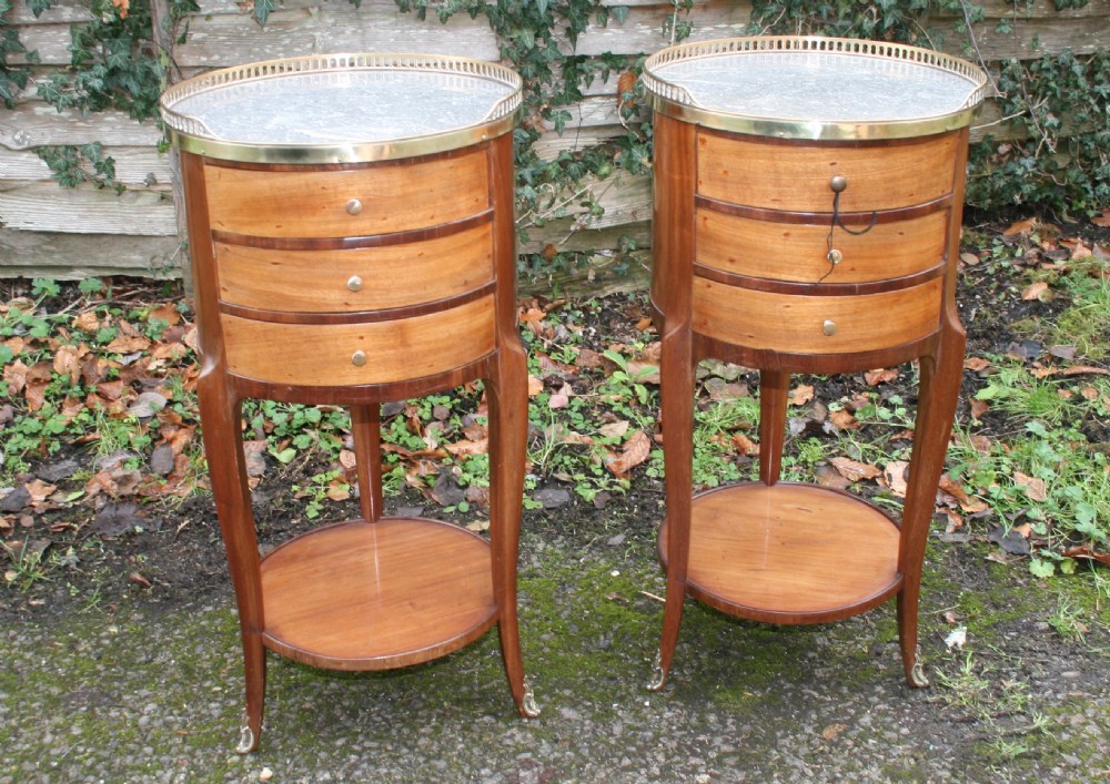 pair of round french bedside tables in mahogany 
